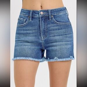 Brand new with tags. Risen jean shorts. Frayed hem. Medium wash. Multiple sizes